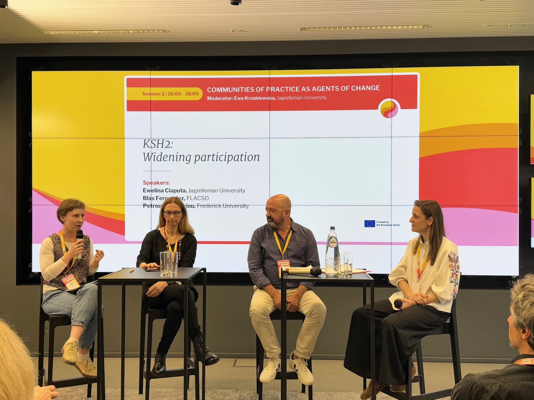 Picture presents panelists discussing CoP's experiences during INSPIRE conference